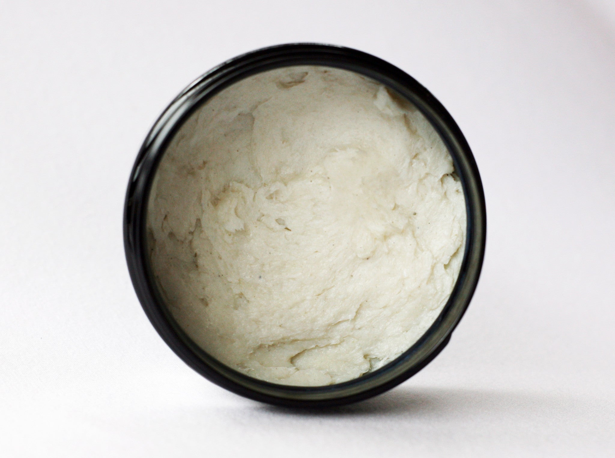 4 oz Citrus Tide Vegan Shave Soap puck pictured in a plastic tub - CreationsByWill